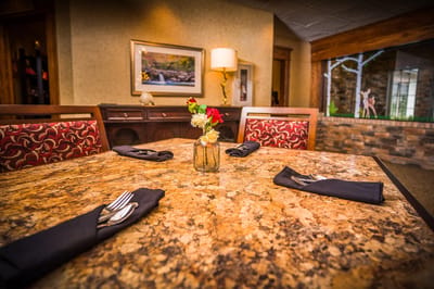 Dining table set with decorations in a dining room.