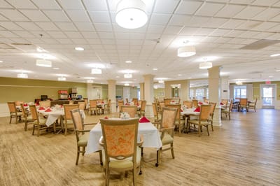 Dining room with tables set for meals.