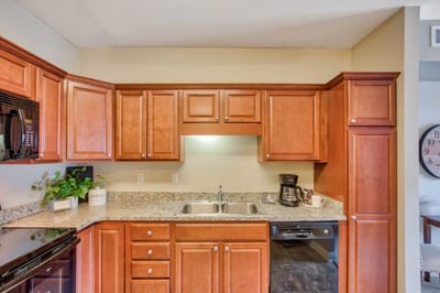 Spacious kitchen with wooden cabinetry