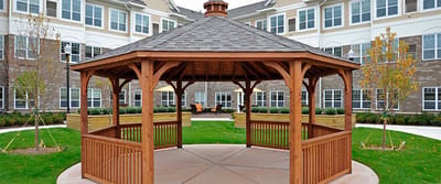 Wooden gazebo in landscaped outdoor area
