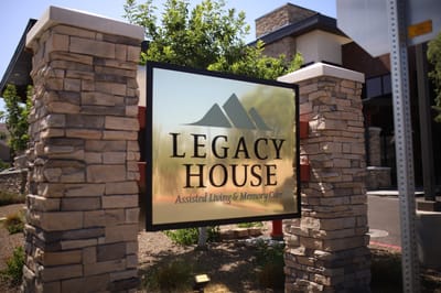 Sign displaying the Legacy House name and services