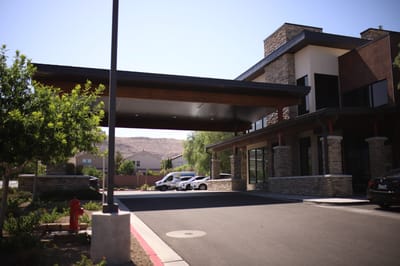 Entrance of a senior living facility with outdoor parking
