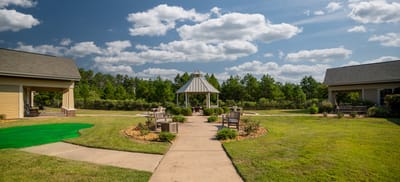 Outdoor seating area with gazebo and landscaping