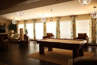 Interior common area with seating and games.