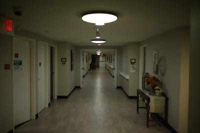 Interior hallway with bright lighting and art on walls
