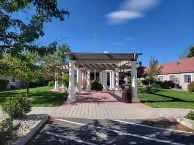 Entrance of a senior living facility with outdoor space