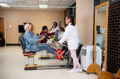Residents engaging in physical therapy exercise session