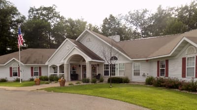 Exterior view of a senior living facility with landscaped grounds