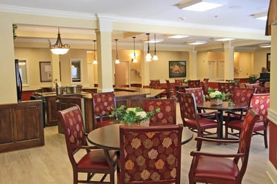 Bright dining area with tables and chairs