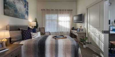 Cozy private resident room with a bed and decor