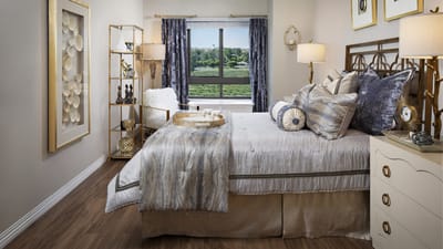 Stylish bedroom in a senior living facility with a view
