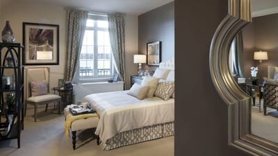 A cozy private room with a bed and seating area