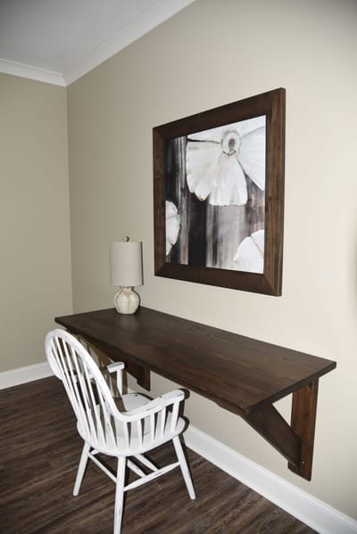 Interior view of a simple desk and wall art