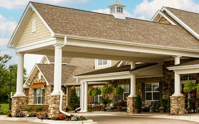 Front entrance of a senior living facility with awning