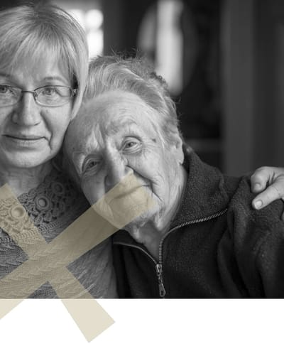 Two elderly women smiling together