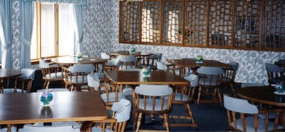 Dining area with wooden tables and chairs