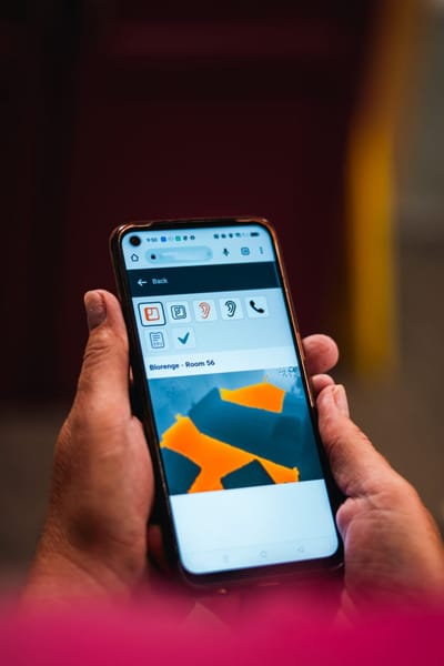 Person holding a smartphone showing an image