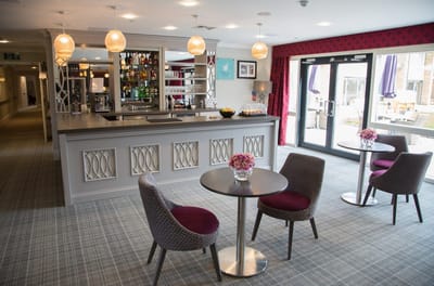 Bright interior of a common area with a bar and seating