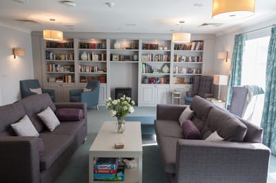 Cozy common area with bookshelves and seating