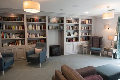Common area with bookshelves and seating