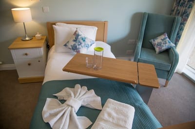 Cozy resident room with a bed and seating area