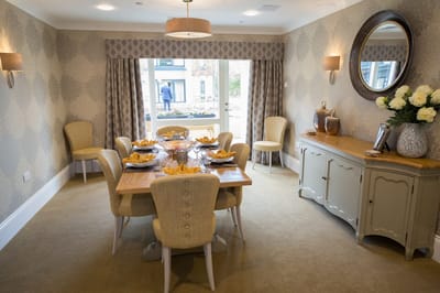 Dining room with a decorated table set for a meal
