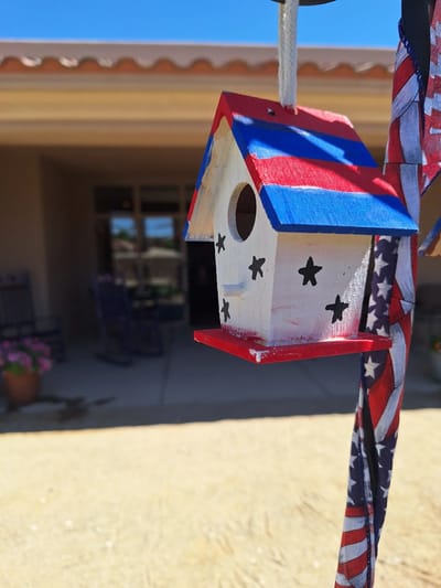 Colorful birdhouse in an outdoor setting
