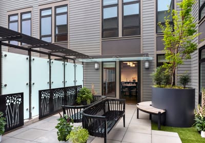 Outdoor courtyard with seating and greenery