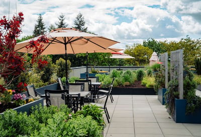 Outdoor patio area with seating and umbrellas