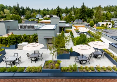 Aerial view of a rooftop outdoor space with seating