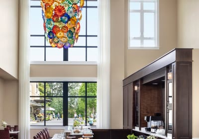 Interior view of a bright common area with a chandelier