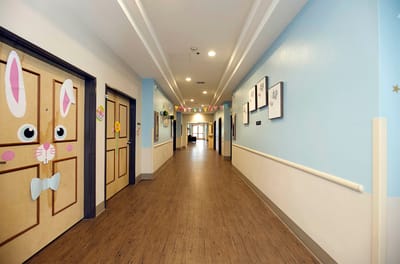 Bright hallway with decorated resident doors