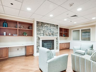 Cozy common area with a fireplace and seating