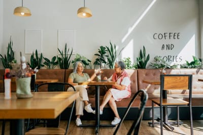 Residents chatting in a bright common area