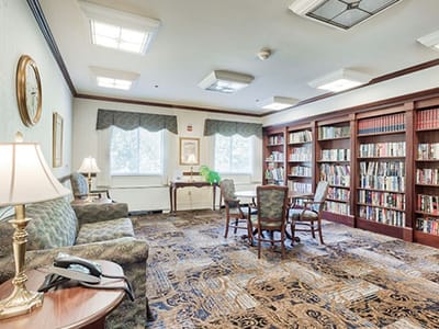 Common area with bookshelves and seating