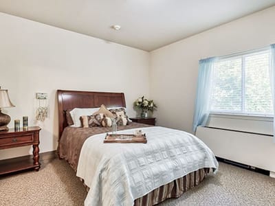 Cozy private resident room with a bed and decor