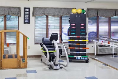 Rehabilitation equipment in a well-lit therapy room