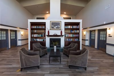 Interior lounge area with seating and bookshelves