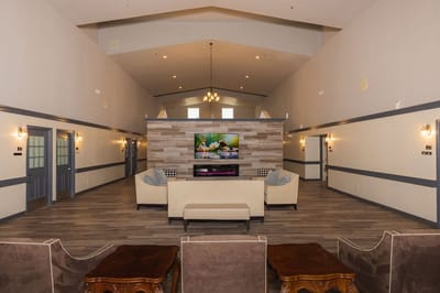 Bright common area with couches and a television