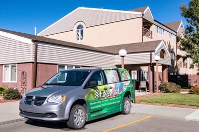 Facility van parked in front of the building