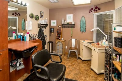 Interior hair salon with styling chairs and products
