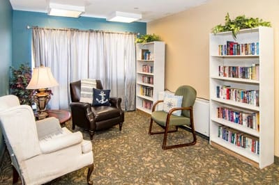 Cozy common area with bookshelves and seating