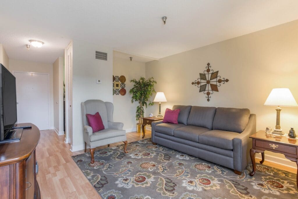 Cozy living room area with a couch and lamp