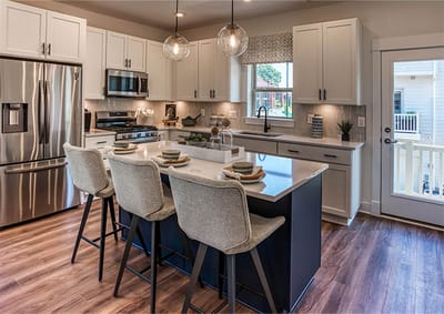 Modern kitchen interior with seating and appliances