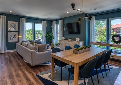 Bright common area featuring a lounge and dining space
