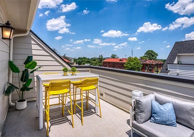Outdoor lounge area with seating and planters