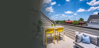 Outdoor seating area with bright yellow chairs