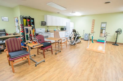 Rehabilitation room with equipment for therapy exercises