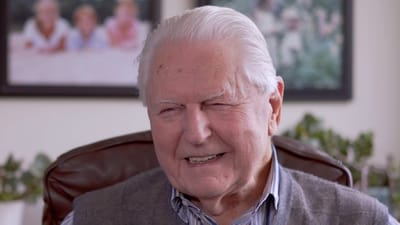 Smiling elderly man in a cozy setting