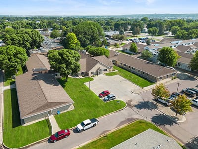 Good Samaritan Society Sioux Falls Village, Nursing Home in Sioux Falls, SD — Aerial view of a senior living facility with landscaped grounds